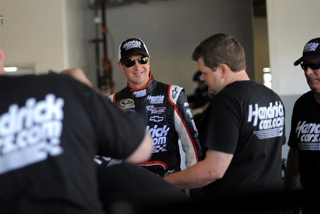 NASCAR Sprint Cup Series driver Kurt Busch (C) speaks to members of his crew next to his number 51 car in the garage area at Daytona Interna NASCAR Sprint Cup Series driver Kurt Busch (C) speaks to members of his crew next to his number 51 car in the garage area at Daytona Interna