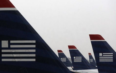 U.S. Airways jets are seen at Reagan National Airport in Washington July 12, 2013. REUTERS/Larry Downing U.S. Airways jets are seen at Reagan National Airport in Washington July 12, 2013. REUTERS/Larry Downing
