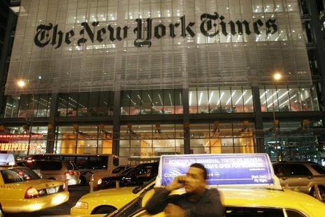 A man speaks on his mobile phone in front of the New York Times building in New York City May 21, 2009. REUTERS/Joel Boh A man speaks on his mobile phone in front of the New York Times building in New York City May 21, 2009. REUTERS/Joel Boh