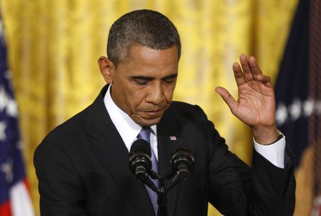 U.S. President Barack Obama waves before departing a news conference in the East Room of the White House in Washington, August 9, 2013. REUT U.S. President Barack Obama waves before departing a news conference in the East Room of the White House in Washington, August 9, 2013. REUT