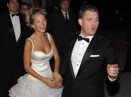 Canadian singer Michael Buble and his bride Argentine actress Luisana Lopilato pose for photographers after their religious wedding ceremony Canadian singer Michael Buble and his bride Argentine actress Luisana Lopilato pose for photographers after their religious wedding ceremony