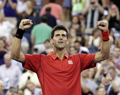 Novak Djokovic of Serbia celebrates defeating Ricardas Berankis of Lithuania during their first round match at the U.S. Open tennis champion Novak Djokovic of Serbia celebrates defeating Ricardas Berankis of Lithuania during their first round match at the U.S. Open tennis champion
