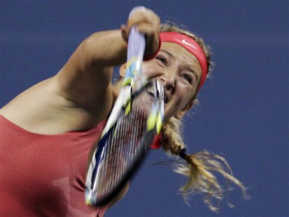 Victoria Azarenka of Belarus serves to Dinah Pfizenmaier of Germany during their first round match at the U.S. Open tennis championships in Victoria Azarenka of Belarus serves to Dinah Pfizenmaier of Germany during their first round match at the U.S. Open tennis championships in