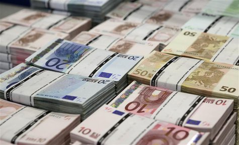 Wads of euro banknotes are stacked in a pile at the GSA Austria (Money Service Austria) company's headquarters in Vienna July 22, 2013. REUT Wads of euro banknotes are stacked in a pile at the GSA Austria (Money Service Austria) company's headquarters in Vienna July 22, 2013. REUT