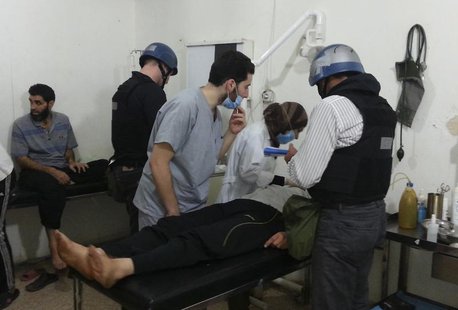U.N. chemical weapons experts visit people affected by an apparent gas attack, at a hospital in the southwestern Damascus suburb of Mouadami U.N. chemical weapons experts visit people affected by an apparent gas attack, at a hospital in the southwestern Damascus suburb of Mouadami