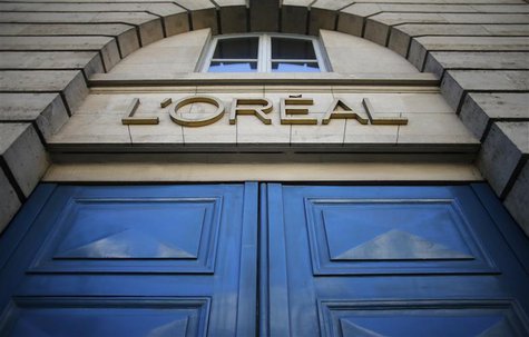 A logo is seen over the entrance of Cosmetics company L'Oreal building in Paris, August 16, 2013. REUTERS/Christian Hartmann A logo is seen over the entrance of Cosmetics company L'Oreal building in Paris, August 16, 2013. REUTERS/Christian Hartmann