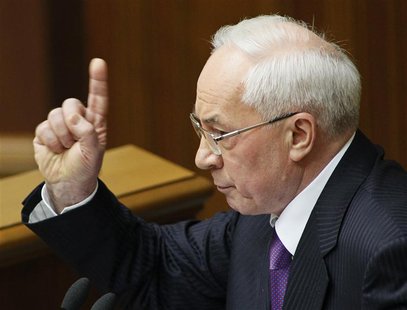 Ukraine's Prime Minister Mykola Azarov gestures during a session of the parliament in Kiev April 19, 2013. REUTERS/Gleb Garanich Ukraine's Prime Minister Mykola Azarov gestures during a session of the parliament in Kiev April 19, 2013. REUTERS/Gleb Garanich