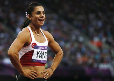 Turkey's Nevin Yanit reacts after her women's 100m hurdles semi-final during the London 2012 Olympic Games at the Olympic Stadium August 7, Turkey's Nevin Yanit reacts after her women's 100m hurdles semi-final during the London 2012 Olympic Games at the Olympic Stadium August 7,