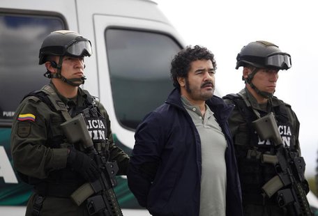 Colombian National Police escort Diego Perez Henao, also known as "Diego Rastrojo", suspected leader from International drug gang "Los Rastr Colombian National Police escort Diego Perez Henao, also known as "Diego Rastrojo", suspected leader from International drug gang "Los Rastr