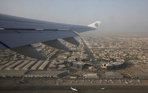 The logo of Emirates airline is seen on the wing of one of their airplanes after takeoff from Dubai airport April,16,2013. REUTERS/Ahmed Jad The logo of Emirates airline is seen on the wing of one of their airplanes after takeoff from Dubai airport April,16,2013. REUTERS/Ahmed Jad