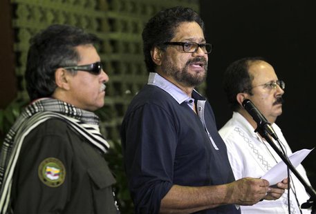 Colombia's Revolutionary Armed Forces of Colombia (FARC) lead negotiator Ivan Marquez (C) reads a document as (FARC) members Jesus Santrich Colombia's Revolutionary Armed Forces of Colombia (FARC) lead negotiator Ivan Marquez (C) reads a document as (FARC) members Jesus Santrich