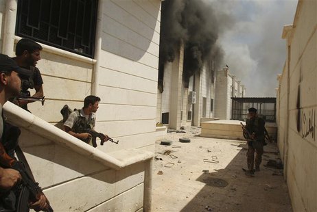Free Syrian Army fighters carry weapons as they take up positions during an offensive against forces loyal to Syria's President Bashar al-As Free Syrian Army fighters carry weapons as they take up positions during an offensive against forces loyal to Syria's President Bashar al-As