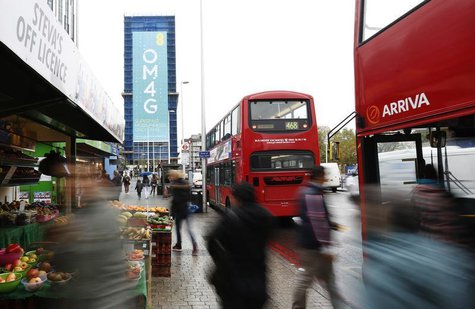 A billboard advertises 4G mobile telecom services of market leader EE, owned by France Telecom and Deutsche Telekom, at Elephant & Castle in A billboard advertises 4G mobile telecom services of market leader EE, owned by France Telecom and Deutsche Telekom, at Elephant & Castle in