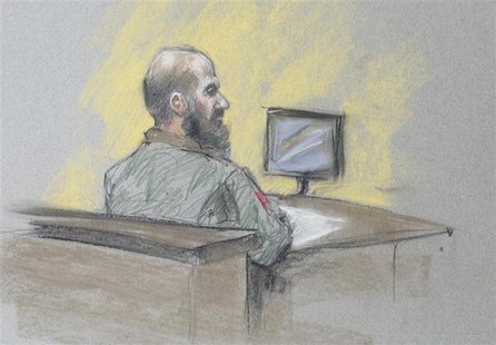 U.S. Army Major Nidal Hasan looks at panel president during reading of his sentence, the first time Hasan looked in the direction of the pan U.S. Army Major Nidal Hasan looks at panel president during reading of his sentence, the first time Hasan looked in the direction of the pan