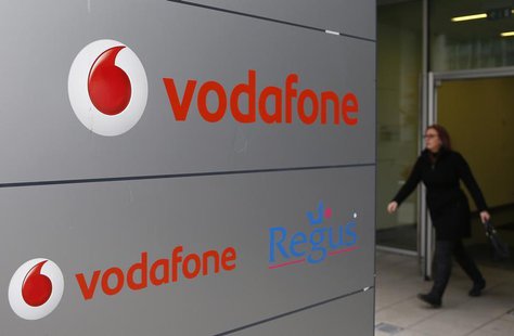 A woman walks past the logo of Vodafone company in Luxembourg in this picture taken on November 20, 2012. REUTERS/Francois Lenoir A woman walks past the logo of Vodafone company in Luxembourg in this picture taken on November 20, 2012. REUTERS/Francois Lenoir