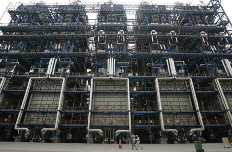 Workers walk inside China National Petroleum Corporation (CNPC) Lanzhou Chemical Company in Lanzhou, capital of northwest China's Gansu prov Workers walk inside China National Petroleum Corporation (CNPC) Lanzhou Chemical Company in Lanzhou, capital of northwest China's Gansu prov