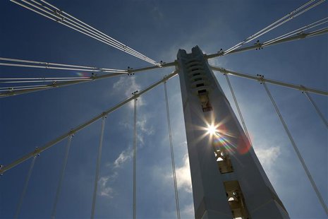 The sun shines through the Bay Bridge's Self-Anchored Suspension tower in San Francisco, California August 26, 2013. REUTERS/Robert Galbrait The sun shines through the Bay Bridge's Self-Anchored Suspension tower in San Francisco, California August 26, 2013. REUTERS/Robert Galbrait