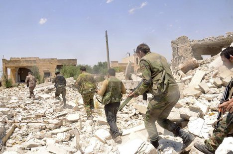 Forces loyal to Syria's President Bashar al-Assad carry their weapons as they move during what they said was an operation to push rebels fro Forces loyal to Syria's President Bashar al-Assad carry their weapons as they move during what they said was an operation to push rebels fro