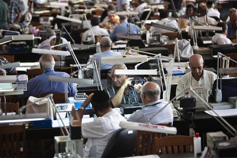 Diamond dealers work on the trading floor of Israel's diamond exchange in Ramat Gan near Tel Aviv October 30, 2012. REUTERS/ Nir Elias Diamond dealers work on the trading floor of Israel's diamond exchange in Ramat Gan near Tel Aviv October 30, 2012. REUTERS/ Nir Elias
