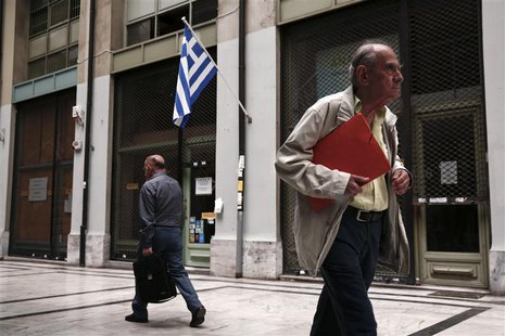 People walk past closed shops at an arcade in central Athens June 6, 2013. REUTERS/Yorgos Karahalis People walk past closed shops at an arcade in central Athens June 6, 2013. REUTERS/Yorgos Karahalis