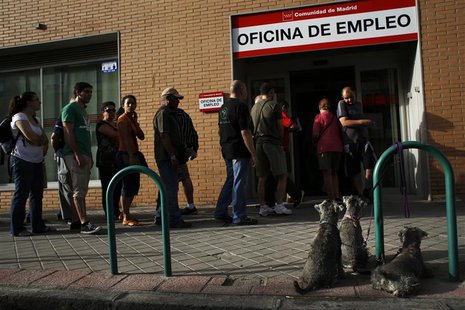 Dogs wait for their owner as people enter a government-run employment office in Madrid August 2, 2013. REUTERS/Susana Vera Dogs wait for their owner as people enter a government-run employment office in Madrid August 2, 2013. REUTERS/Susana Vera