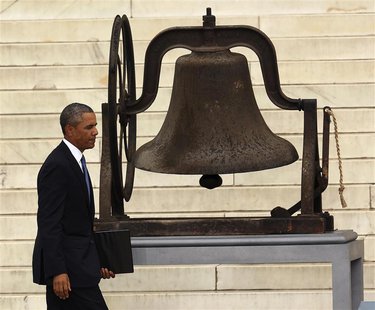 U.S. President Barack Obama walks to the podium to speak at the Lincoln Memorial during ceremonies celebrating the 50th anniversary of the 1 U.S. President Barack Obama walks to the podium to speak at the Lincoln Memorial during ceremonies celebrating the 50th anniversary of the 1
