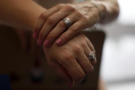 Sallee Taylor, 41, (L) and her wife Andrea Taylor, 41, hold hands after getting married in West Hollywood, California, July 1, 2013. REUTERS Sallee Taylor, 41, (L) and her wife Andrea Taylor, 41, hold hands after getting married in West Hollywood, California, July 1, 2013. REUTERS