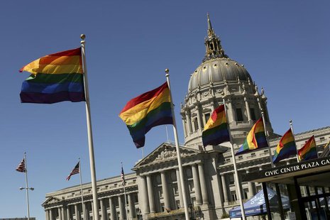 Rainbow colored flags fly outside City Hall in San Francisco, California June 28, 2013. REUTERS/Robert Galbraith Rainbow colored flags fly outside City Hall in San Francisco, California June 28, 2013. REUTERS/Robert Galbraith