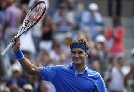 Roger Federer of Switzerland celebrates after defeating Carlos Berlocq of Argentina in their match at the U.S. Open tennis championships in Roger Federer of Switzerland celebrates after defeating Carlos Berlocq of Argentina in their match at the U.S. Open tennis championships in