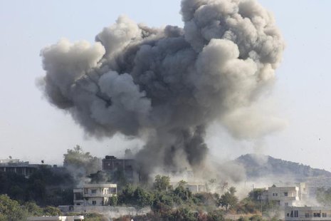 Smoke rises after what activists said was shelling by forces loyal to Syria's President Bashar al-Assad in the village of Dourit, in Latakia Smoke rises after what activists said was shelling by forces loyal to Syria's President Bashar al-Assad in the village of Dourit, in Latakia