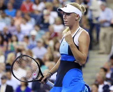 Caroline Wozniacki of Denmark celebrates winning her match against Chanelle Scheepers of South Africa at the U.S. Open tennis championships Caroline Wozniacki of Denmark celebrates winning her match against Chanelle Scheepers of South Africa at the U.S. Open tennis championships