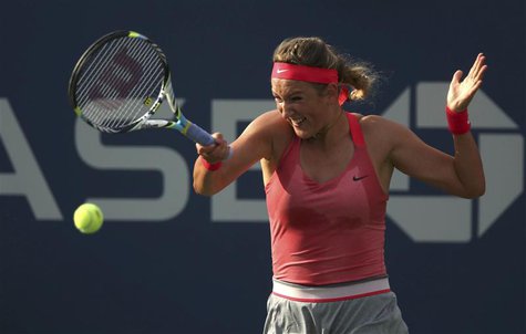 Victoria Azarenka of Belarus hits a return to Aleksandra Wozniak of Canada at the U.S. Open tennis championships in New York August 29, 2013 Victoria Azarenka of Belarus hits a return to Aleksandra Wozniak of Canada at the U.S. Open tennis championships in New York August 29, 2013