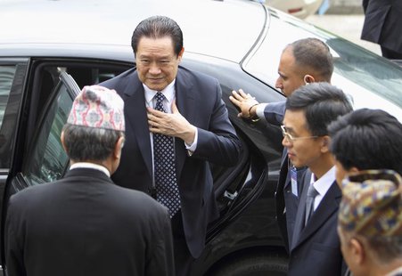 China's Politburo Standing Committee Member Zhou Yongkang (L) arrives for a meeting with Nepal's caretaker Prime Minister Jhala Nath Khanal China's Politburo Standing Committee Member Zhou Yongkang (L) arrives for a meeting with Nepal's caretaker Prime Minister Jhala Nath Khanal