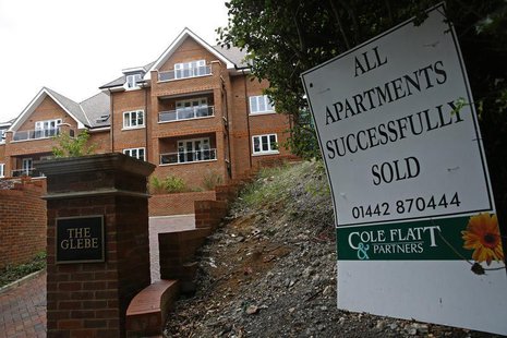 A sign is seen outside some newly built apartments in Berkhampstead, southern England August 13, 2013. REUTERS/Eddie Keogh A sign is seen outside some newly built apartments in Berkhampstead, southern England August 13, 2013. REUTERS/Eddie Keogh