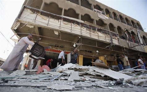 People gather at the site of a car bomb attack in Baghdad's al-Shaab district August 28, 2013. REUTERS/Saad Shalash People gather at the site of a car bomb attack in Baghdad's al-Shaab district August 28, 2013. REUTERS/Saad Shalash