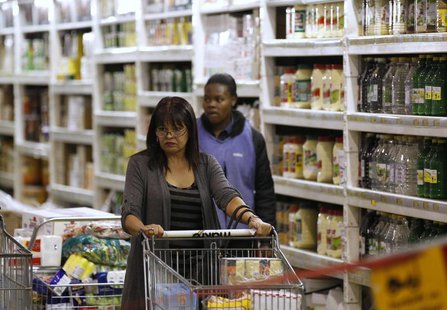 A shopper pushes a trolley of groceries at the Makro branch of South African retailer Massmart in Johannesburg May 31, 2011. REUTERS/Siphiwe A shopper pushes a trolley of groceries at the Makro branch of South African retailer Massmart in Johannesburg May 31, 2011. REUTERS/Siphiwe