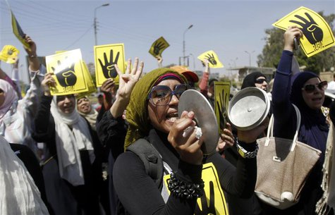 Members of the Muslim Brotherhood and supporters of ousted Egyptian President Mohamed Mursi shout slogans against the military and the inter Members of the Muslim Brotherhood and supporters of ousted Egyptian President Mohamed Mursi shout slogans against the military and the inter