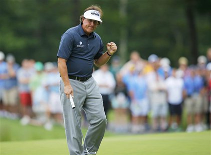 Phil Mickelson of the U.S. pumps his fist after a birdie on the 14th hole during the first round of the Deutsche Bank Championship in Norton Phil Mickelson of the U.S. pumps his fist after a birdie on the 14th hole during the first round of the Deutsche Bank Championship in Norton