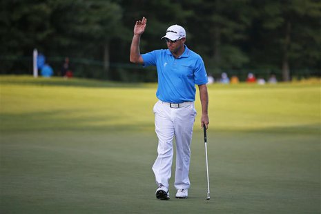 Brian Davis of Britain acknowledges the crowd after finishing his first round of the Deutsche Bank Championship golf tournament in Norton, M Brian Davis of Britain acknowledges the crowd after finishing his first round of the Deutsche Bank Championship golf tournament in Norton, M