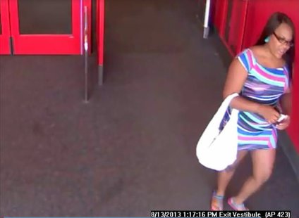 Suspect sought in counterfeit money incidents at Bellevue Target store on Aug. 13, 2013. (Photo by: Brown County Sheriff's Department). Suspect sought in counterfeit money incidents at Bellevue Target store on Aug. 13, 2013. (Photo by: Brown County Sheriff's Department).