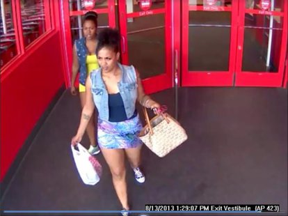 Suspects sought in counterfeit money incidents at Bellevue Target store on Aug. 13, 2013. (Photo by: Brown County Sheriff's Department). Suspects sought in counterfeit money incidents at Bellevue Target store on Aug. 13, 2013. (Photo by: Brown County Sheriff's Department).