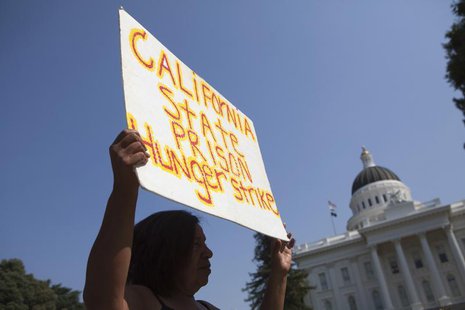 Elaine Gurule holds up a sign during a protest against indefinite solitary confinement in California prisons, at the State Capitol in Sacram Elaine Gurule holds up a sign during a protest against indefinite solitary confinement in California prisons, at the State Capitol in Sacram
