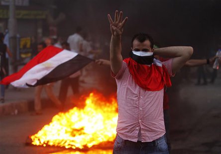 A supporter of ousted Egyptian President Mohamed Mursi makes the "Rabaa" or "Four" gesture during clashes at Mohandiseen in Cairo August 30, A supporter of ousted Egyptian President Mohamed Mursi makes the "Rabaa" or "Four" gesture during clashes at Mohandiseen in Cairo August 30,
