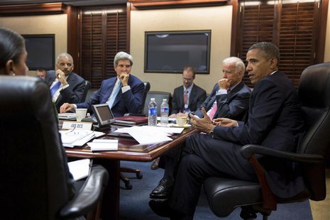 U.S. President Barack Obama (R) meets with his national security staff to discuss the situation in Syria in the Situation Room of the White U.S. President Barack Obama (R) meets with his national security staff to discuss the situation in Syria in the Situation Room of the White