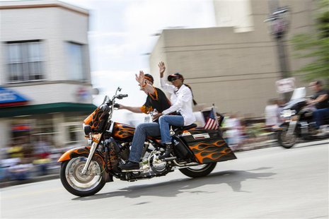 Harley riders wave during the Harley Davidson 110th Anniversary Celebration parade in Wisconsin Avenue, Milwaukee August 31, 2013. REUTERS/S Harley riders wave during the Harley Davidson 110th Anniversary Celebration parade in Wisconsin Avenue, Milwaukee August 31, 2013. REUTERS/S