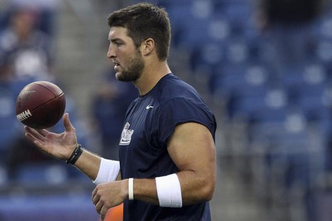 New England Patriots quarterback Tim Tebow warms up before facing the New York Giants in their NFL preseason game in Foxborough, Massachuset New England Patriots quarterback Tim Tebow warms up before facing the New York Giants in their NFL preseason game in Foxborough, Massachuset