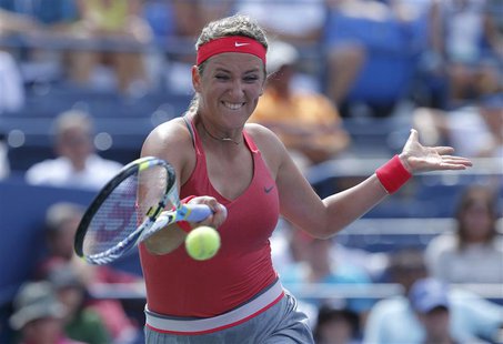 Victoria Azarenka of Belarus hits a return to Alize Cornet of France at the U.S. Open tennis championships in New York August 31, 2013. REUT Victoria Azarenka of Belarus hits a return to Alize Cornet of France at the U.S. Open tennis championships in New York August 31, 2013. REUT