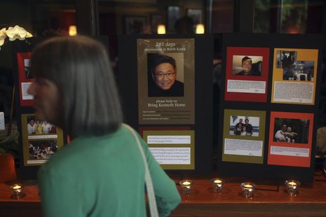 A woman walks past an informational booth detailing the life of Kenneth Bae during a vigil for Bae in Seattle, Washington August 10, 2013. R A woman walks past an informational booth detailing the life of Kenneth Bae during a vigil for Bae in Seattle, Washington August 10, 2013. R