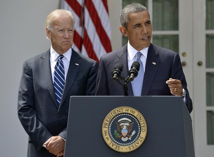 U.S. President Barack Obama speaks next to Vice President Joe Biden (L) at the Rose Garden of the White House August 31, 2013, in Washington U.S. President Barack Obama speaks next to Vice President Joe Biden (L) at the Rose Garden of the White House August 31, 2013, in Washington