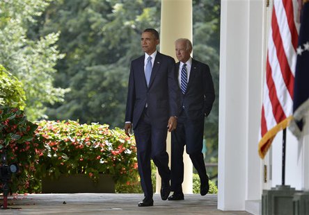 U.S. President Barack Obama walks with Vice President Joe Biden (R) to the Rose Garden of the White House to make remarks on the situation i U.S. President Barack Obama walks with Vice President Joe Biden (R) to the Rose Garden of the White House to make remarks on the situation i